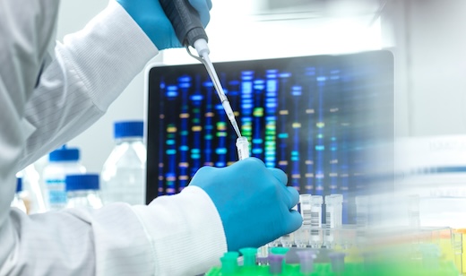 Scientist pipetting sample into a vial for DNA testing
